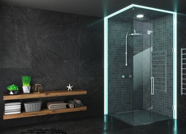 A new glass shower is visible in a black stone and tile-style bathroom.